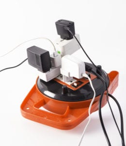 Overloaded power strip with multiple plugs.
