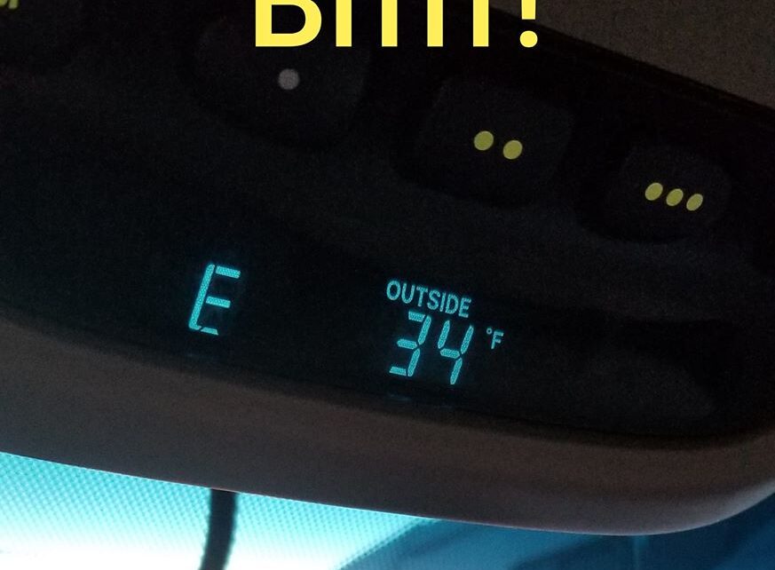 Car thermometer displays 34°F, "Brrrr!" above.
